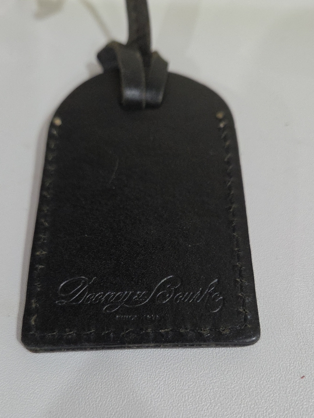 Dooney & Bourke Black Leather Tag with Embossed Logo